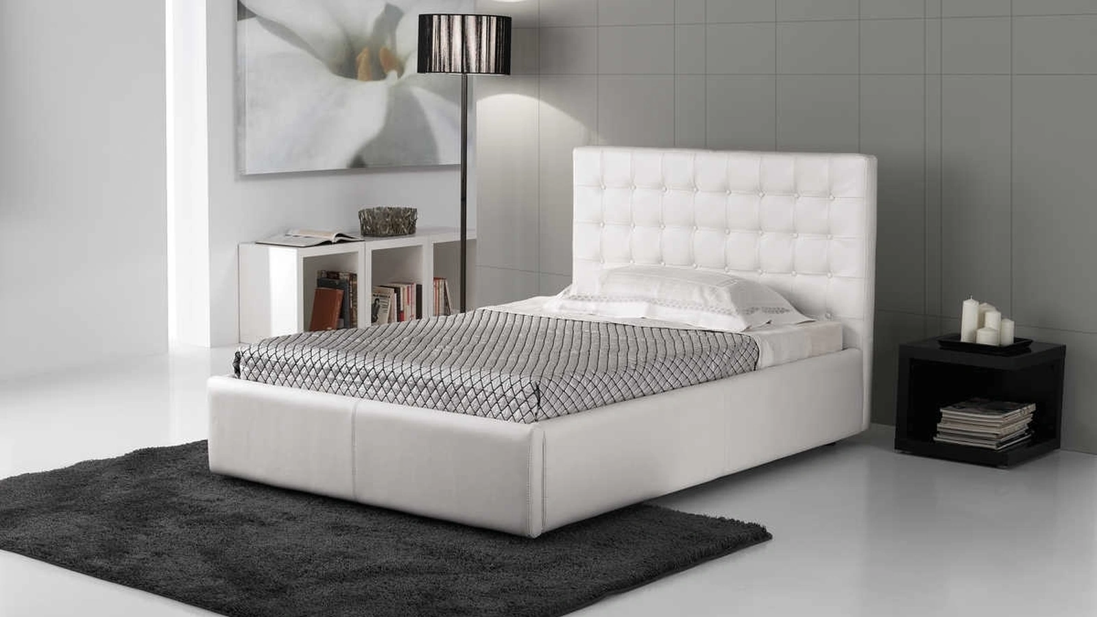 Letto a una piazza e mezza con testiera in pelle trapuntata Blenda di Tancredi salotti