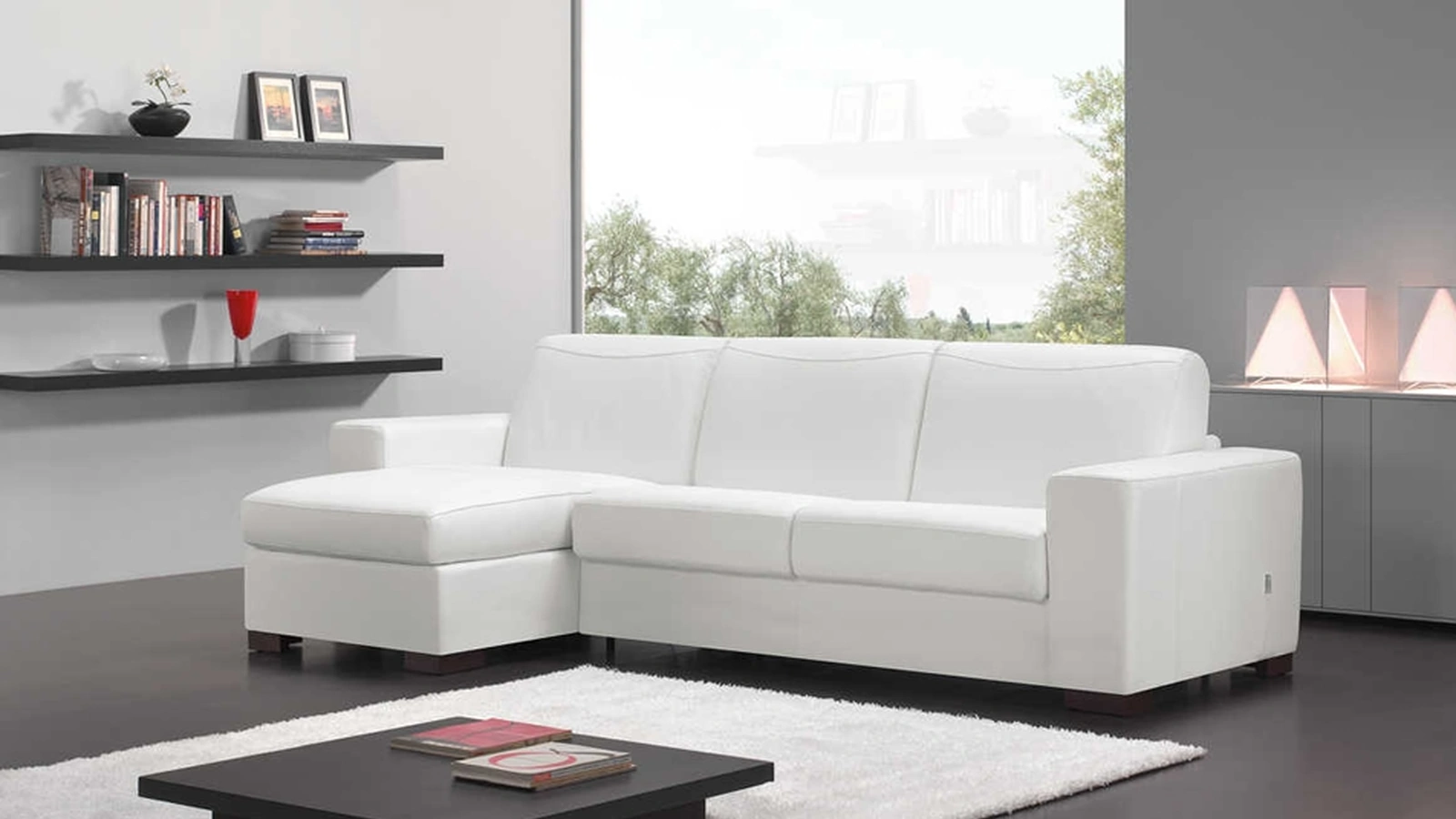 Divano letto con penisola Sara di Tancredi salotti